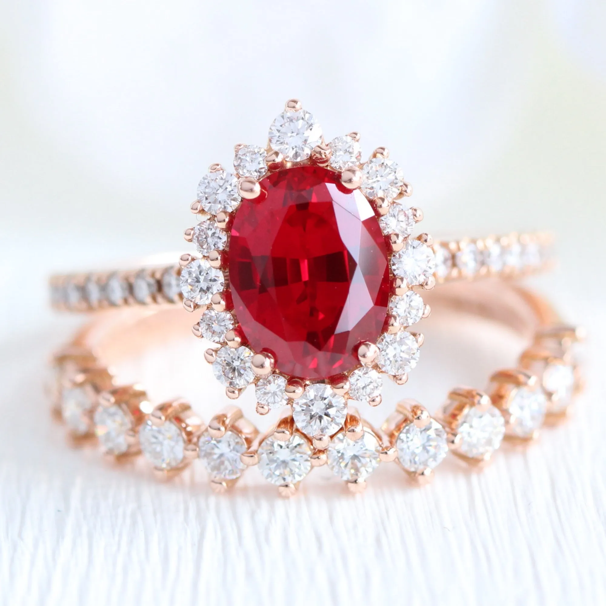Oval Ruby Engagement Ring in Tiara Halo Diamond Pave Band