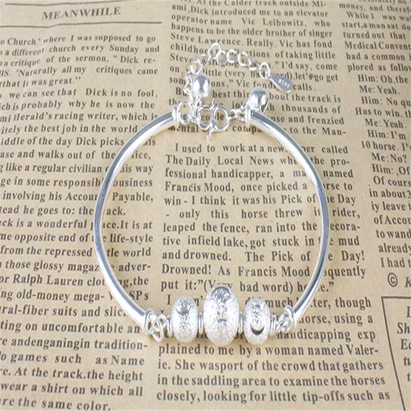 Turning Beads and Bells Silver Plated Bracelet
